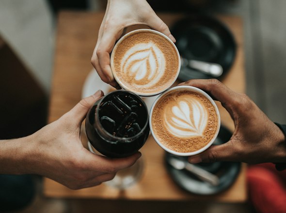 Cups of latte art coffee